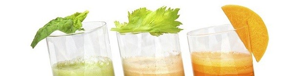 fresh juices from carrot, celery and parsley in glasses isolated on white
