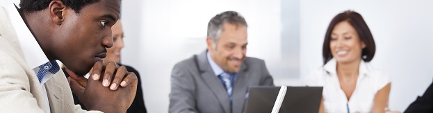 African Businessman Looking At Laptop