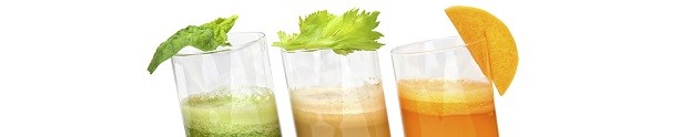 fresh juices from carrot, celery and parsley in glasses isolated on white